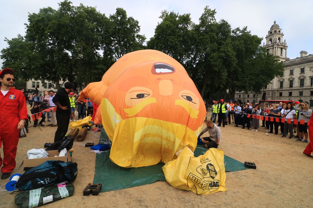 An 18 foot tall Trump Big Baby inflatable Blimp is installed in Parliament Square to protest against the UK visit of President Trump on July 13, 2018  (Amer Ghazzal/Shutterstock)